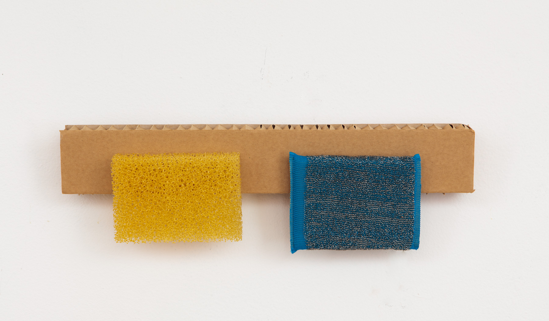 cardboard and yellow and blue scrubbies
